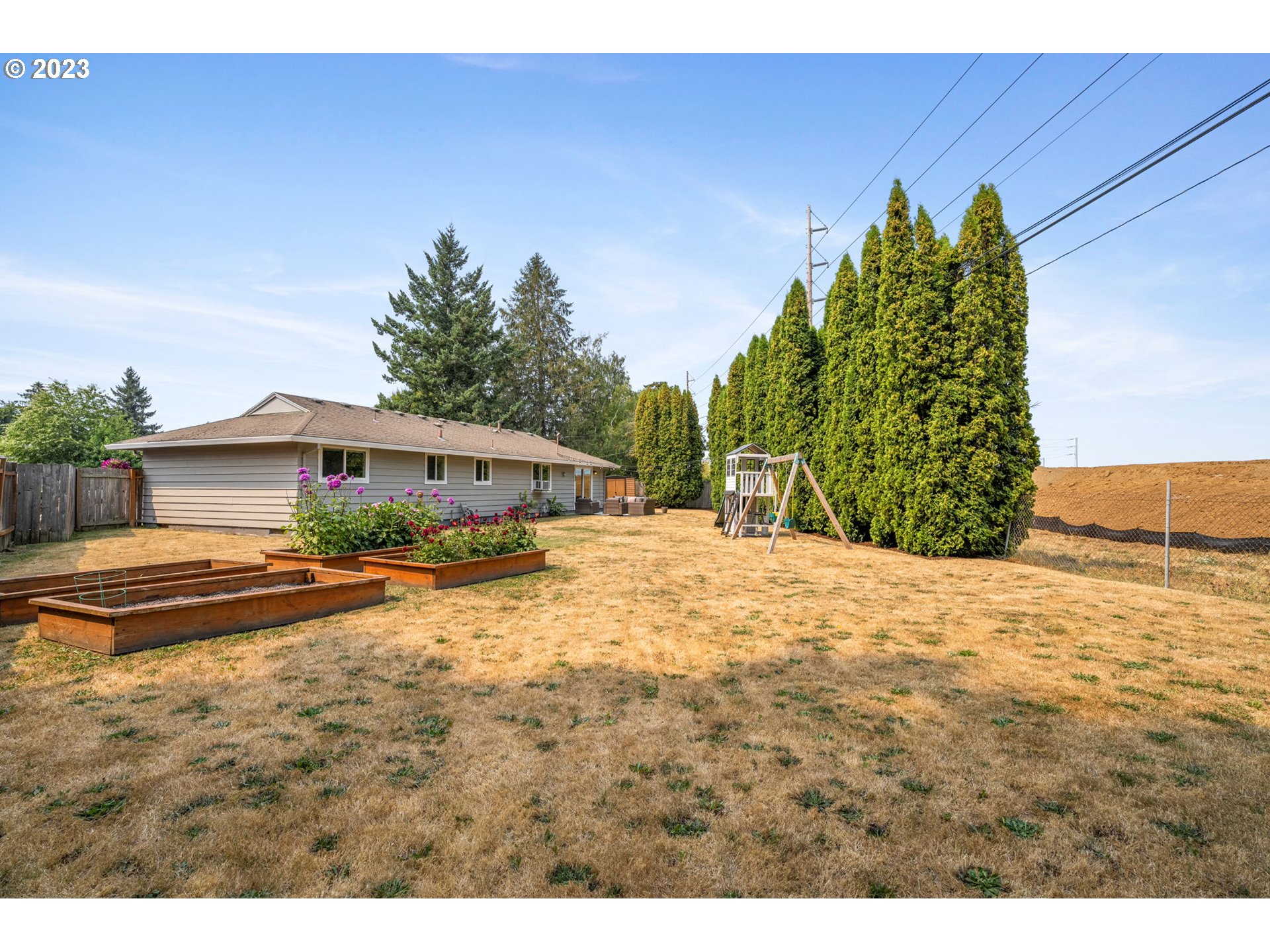 326 Southeast 236th Court Gresham, OR 97030 - Photo 31 of 34 a front view of a house with a yard