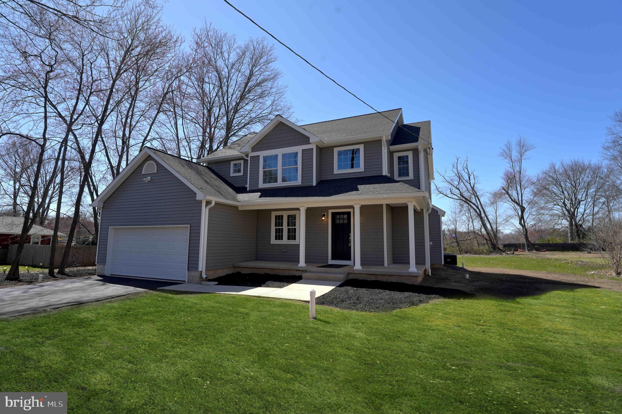 1341 Lower Ferry Road Ewing, NJ 08618 - Photo 1 of 39 a front view of house with yard and green space