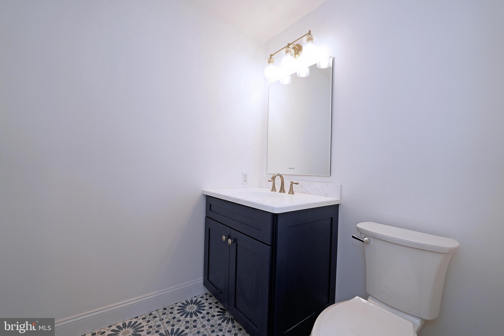 1341 Lower Ferry Road Ewing, NJ 08618 - Photo 18 of 39 a bathroom with a sink vanity and a toilet