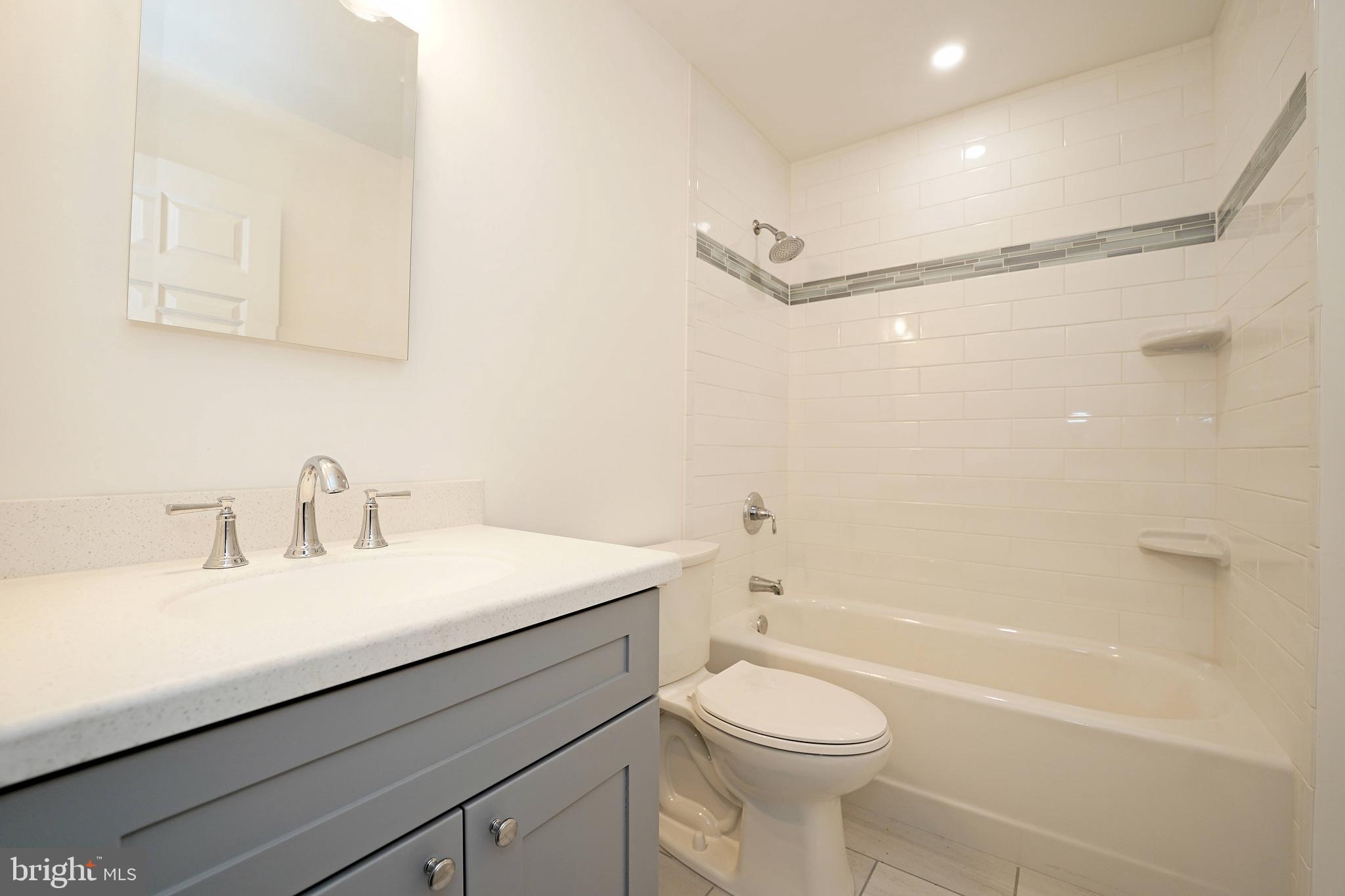 1341 Lower Ferry Road Ewing, NJ 08618 - Photo 31 of 39 a bathroom with a sink a toilet and shower