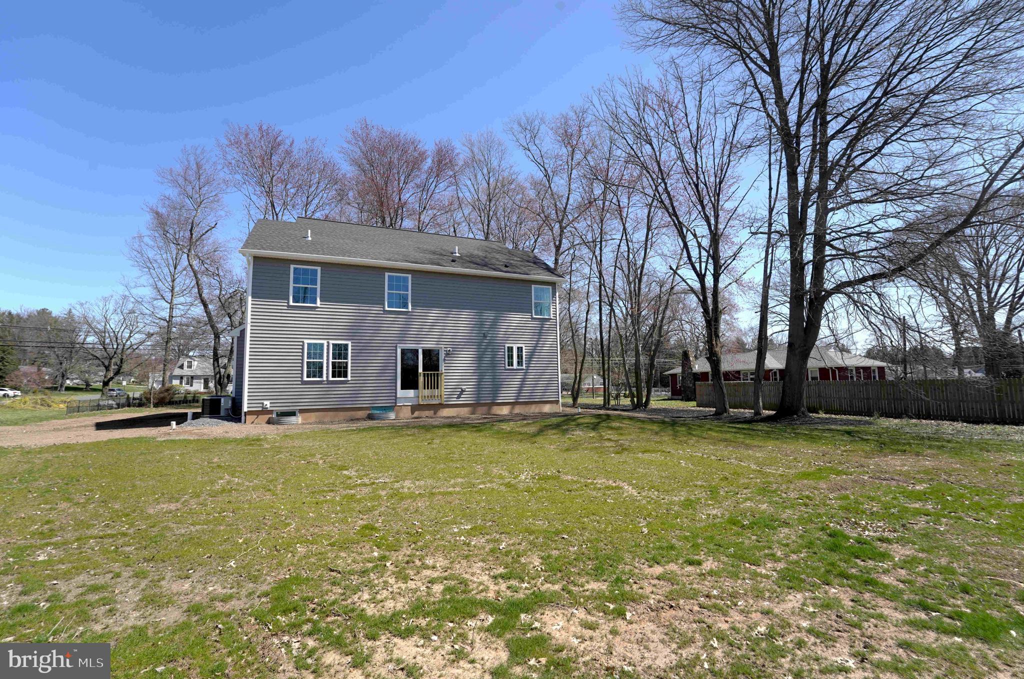 1341 Lower Ferry Road Ewing, NJ 08618 - Photo 38 of 39 a view of a house with pool and trees in the background