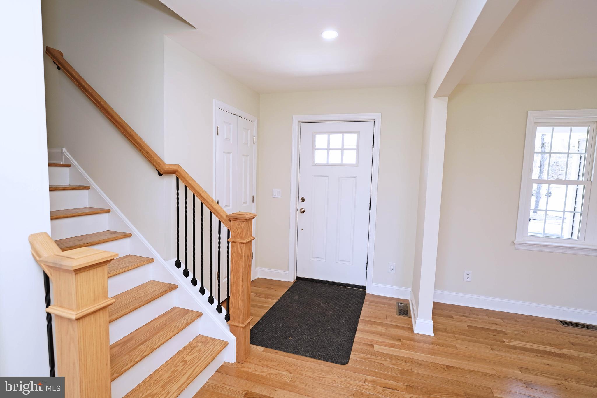 1341 Lower Ferry Road Ewing, NJ 08618 - Photo 4 of 39 a view of a livingroom with wooden floor and stairs