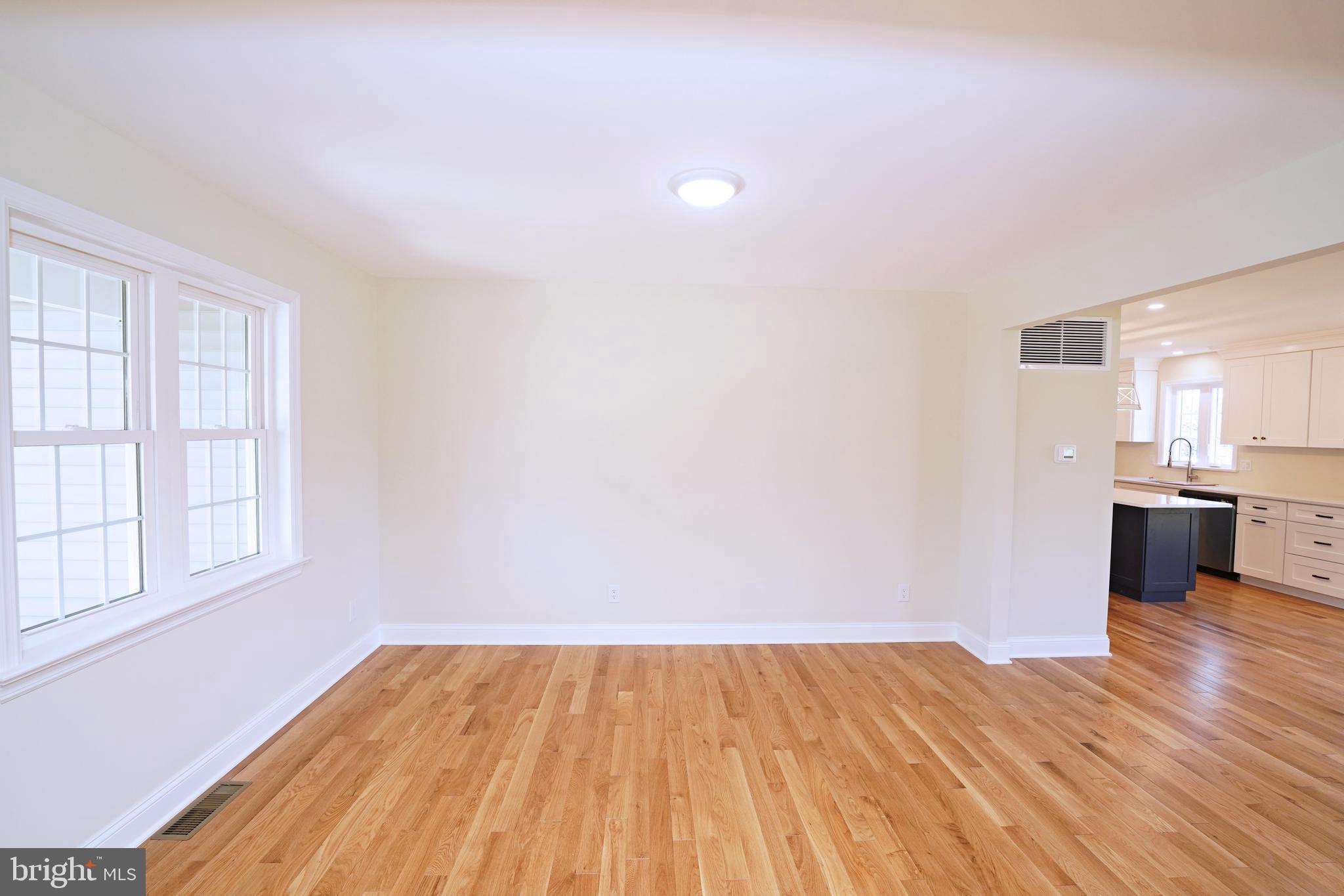 1341 Lower Ferry Road Ewing, NJ 08618 - Photo 6 of 39 a view of a room with wooden floor and a kitchen