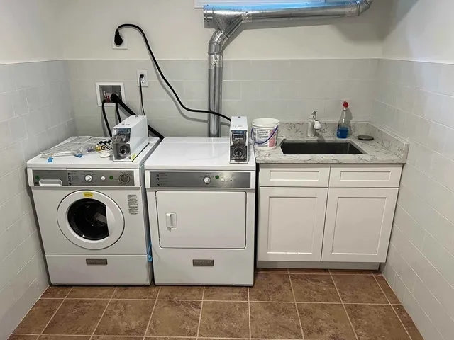 a utility room with dryer and washer
