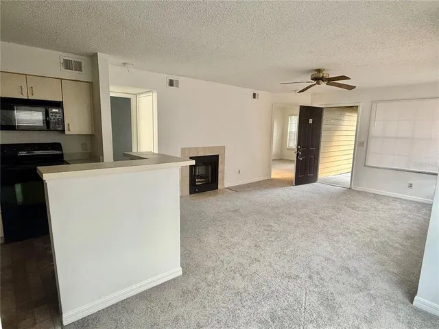 a view of a kitchen with a sink dishwasher and a refrigerator