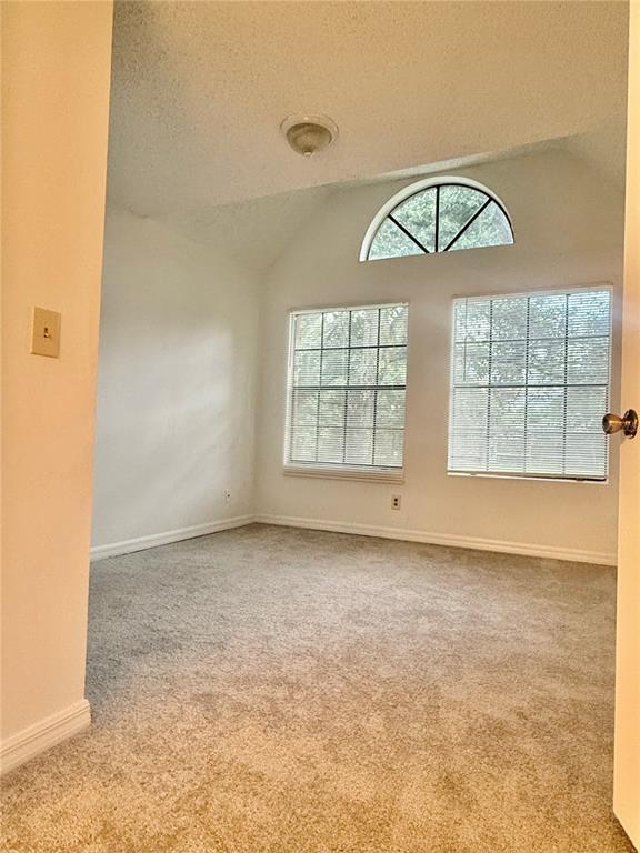 365 Forestway Circle, Unit 101 Altamonte Springs, FL 32701 - Photo 6 of 16 an empty room with a empty space and windows