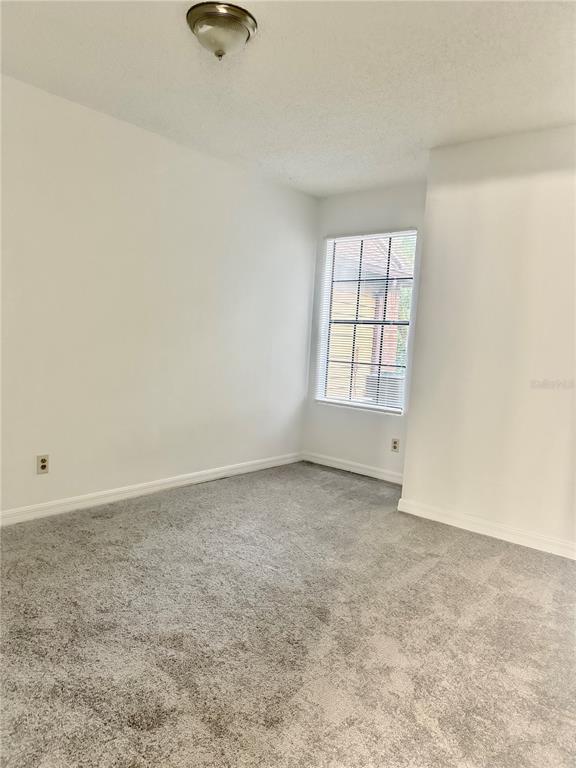 365 Forestway Circle, Unit 101 Altamonte Springs, FL 32701 - Photo 9 of 16 an empty room with windows