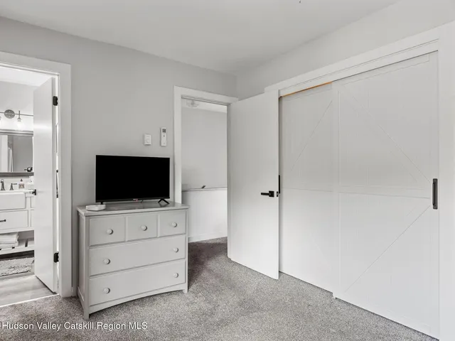 a living room with flat screen tv