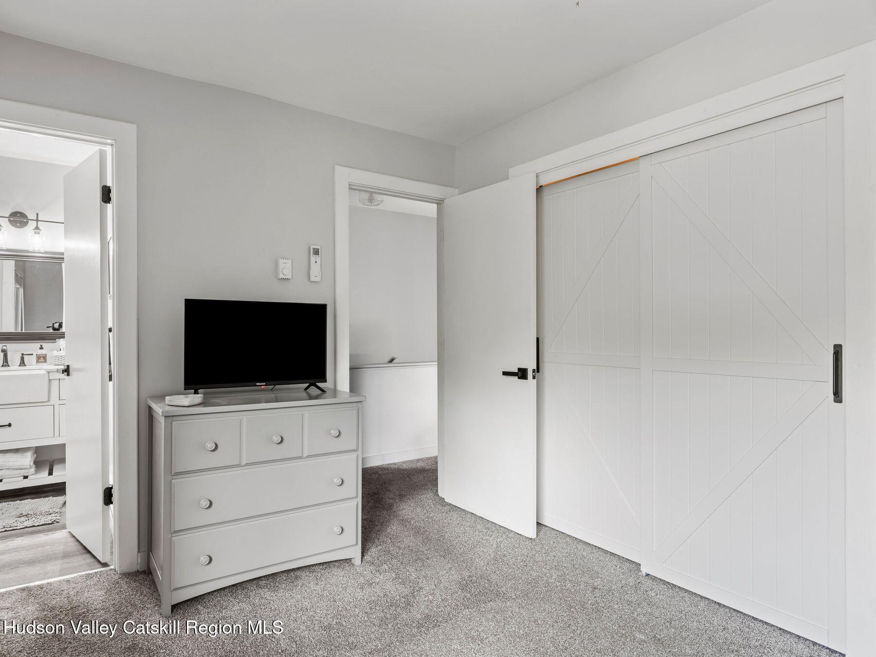 73 Windham Ridge Road, Unit 16H Windham, NY 12496 - Photo 20 of 36 a living room with flat screen tv
