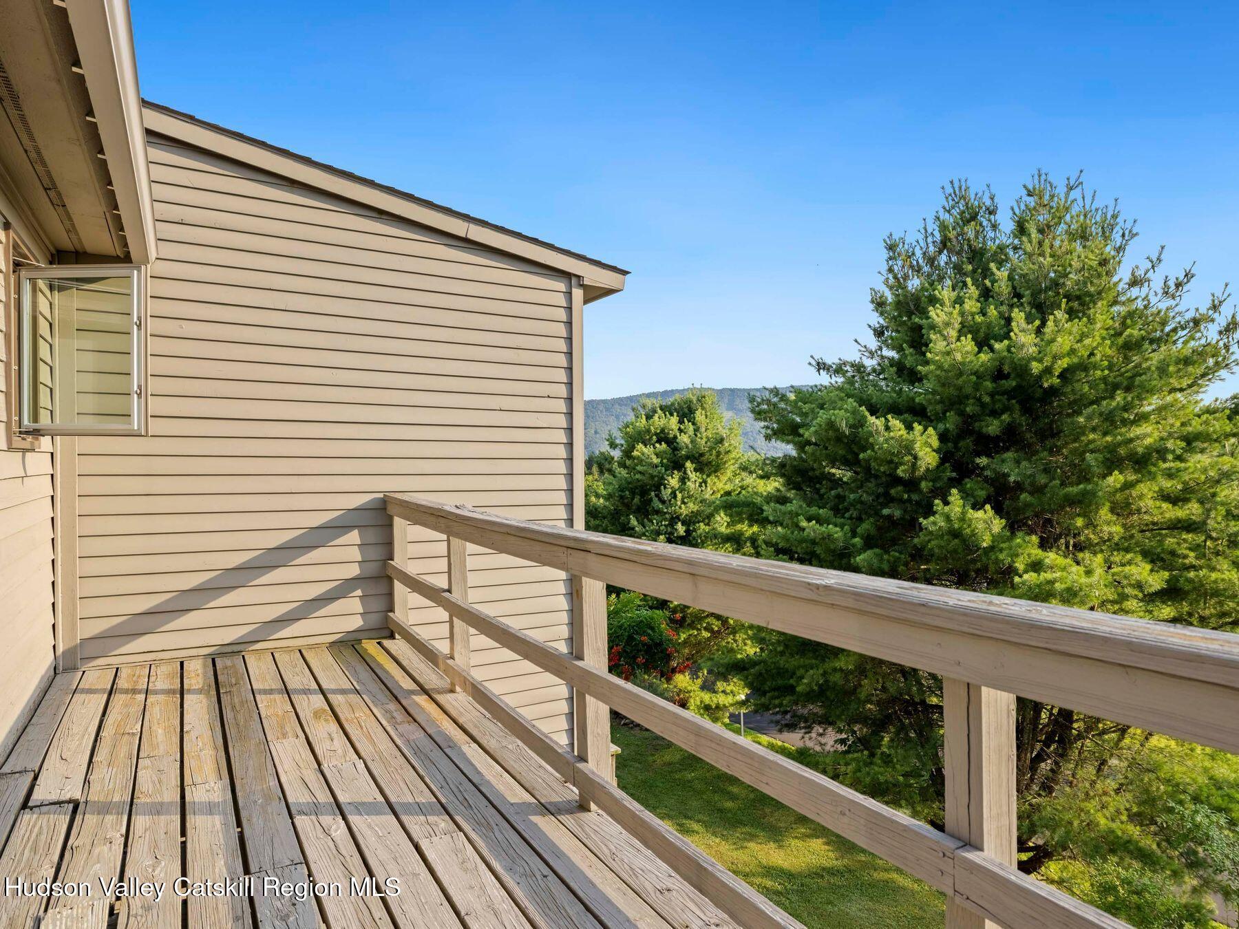 73 Windham Ridge Road, Unit 16H Windham, NY 12496 - Photo 24 of 36 a view of a balcony with wooden floor
