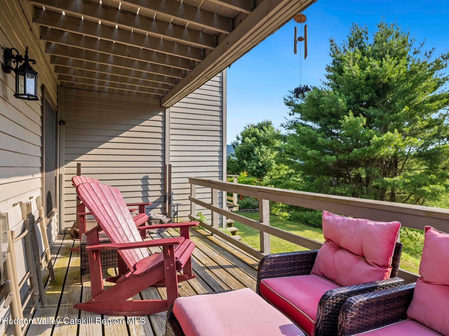 73 Windham Ridge Road, Unit 16H Windham, NY 12496 - Photo 27 of 36 a roof deck with a table and chairs