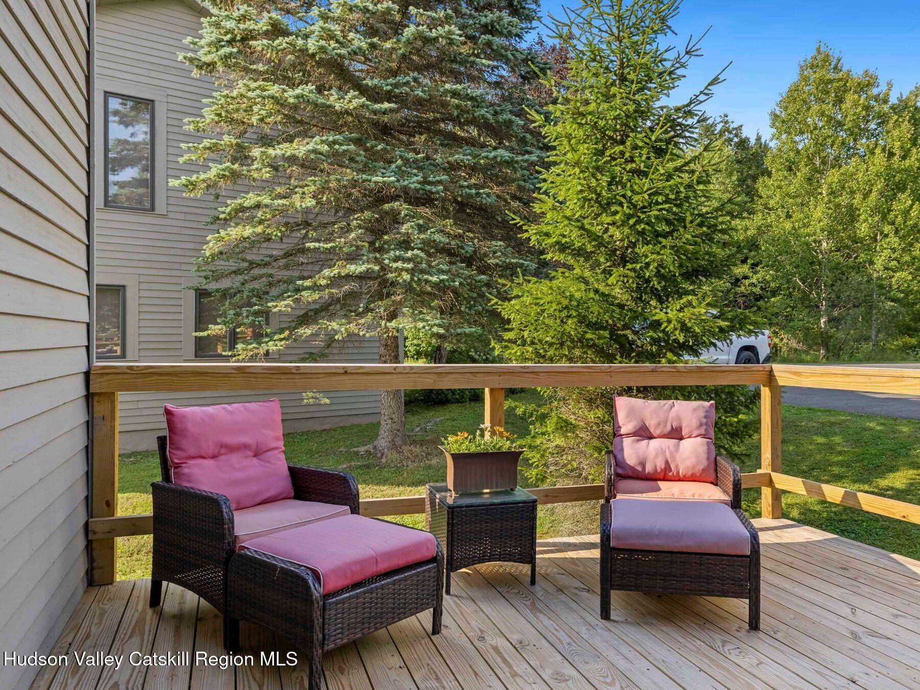 73 Windham Ridge Road, Unit 16H Windham, NY 12496 - Photo 29 of 36 a wooden bench sitting on top of a wooden deck