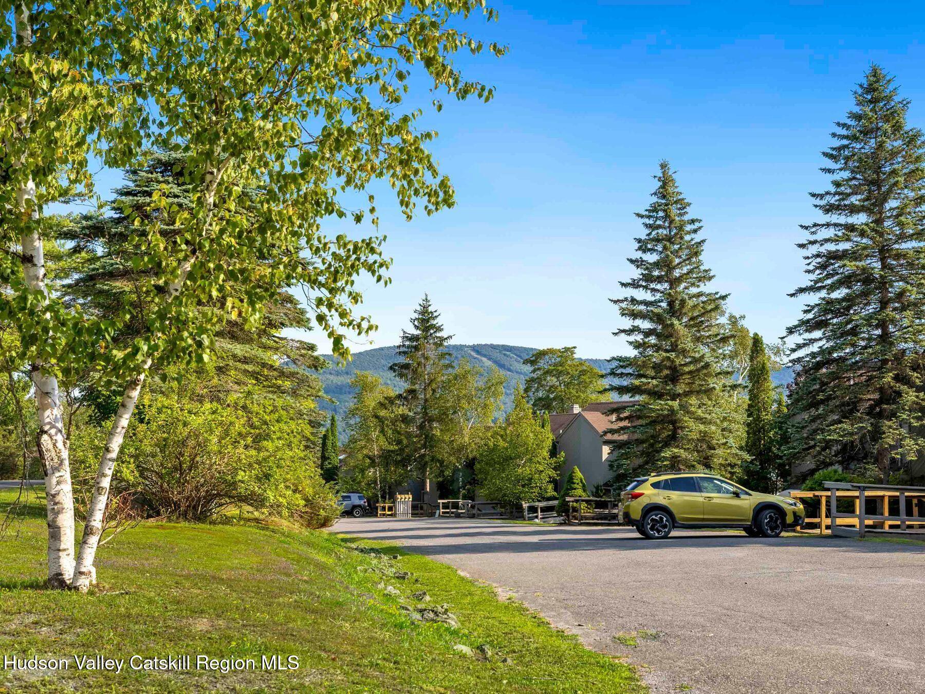 73 Windham Ridge Road, Unit 16H Windham, NY 12496 - Photo 30 of 36 a view of a cars park on the side of a road