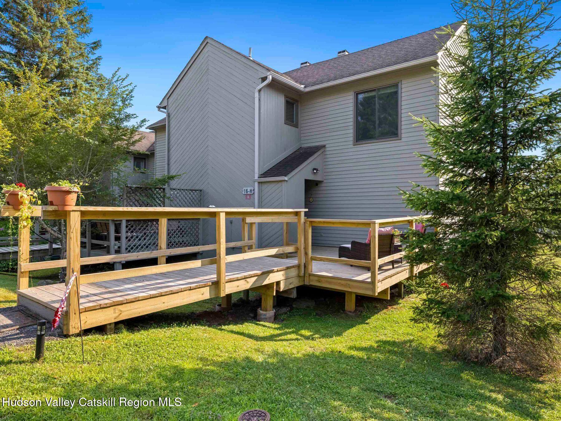 73 Windham Ridge Road, Unit 16H Windham, NY 12496 - Photo 33 of 36 a house view with a garden space
