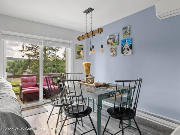 a view of a dining room with furniture window and outside view