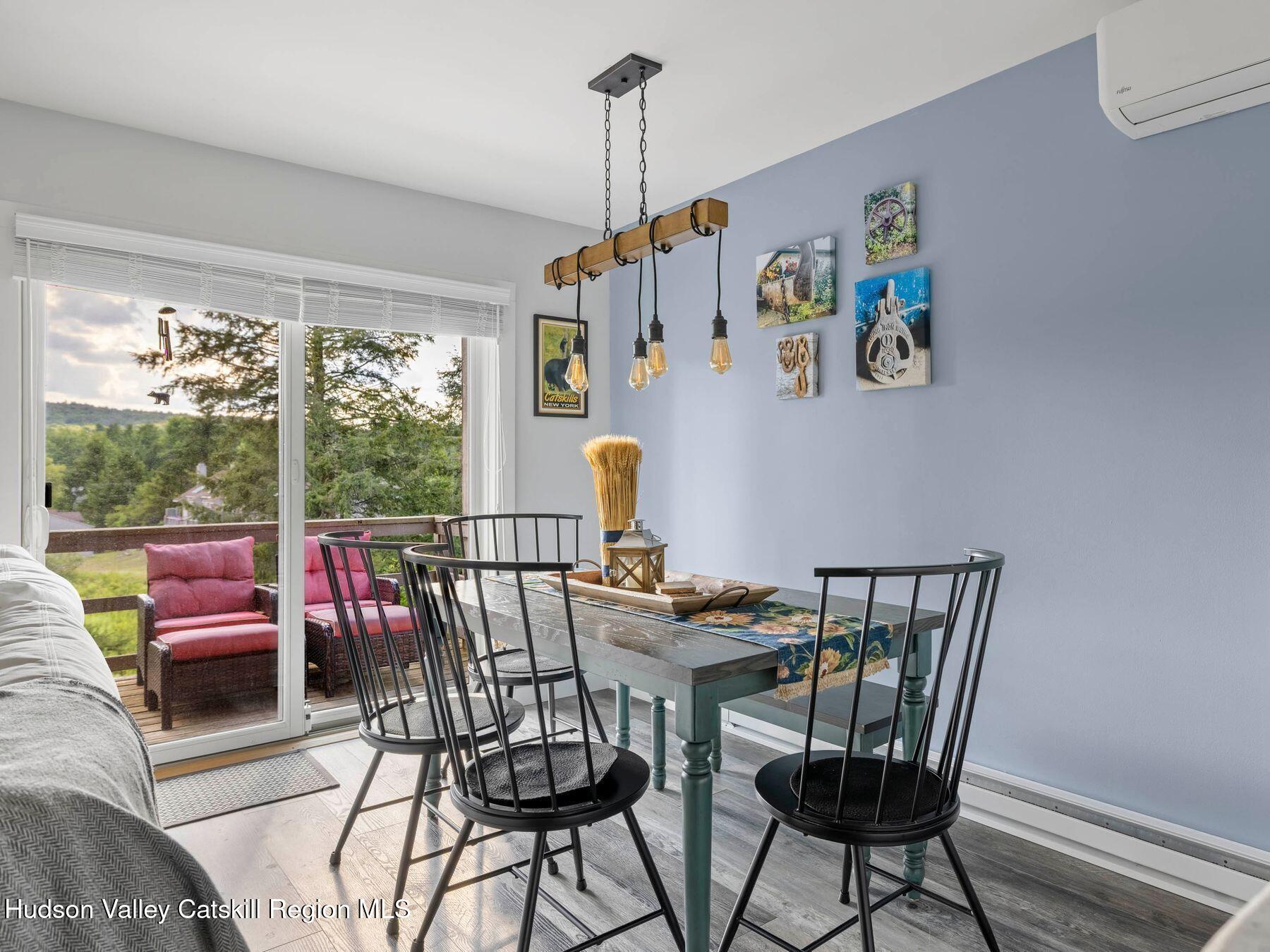 73 Windham Ridge Road, Unit 16H Windham, NY 12496 - Photo 8 of 36 a view of a dining room with furniture window and outside view