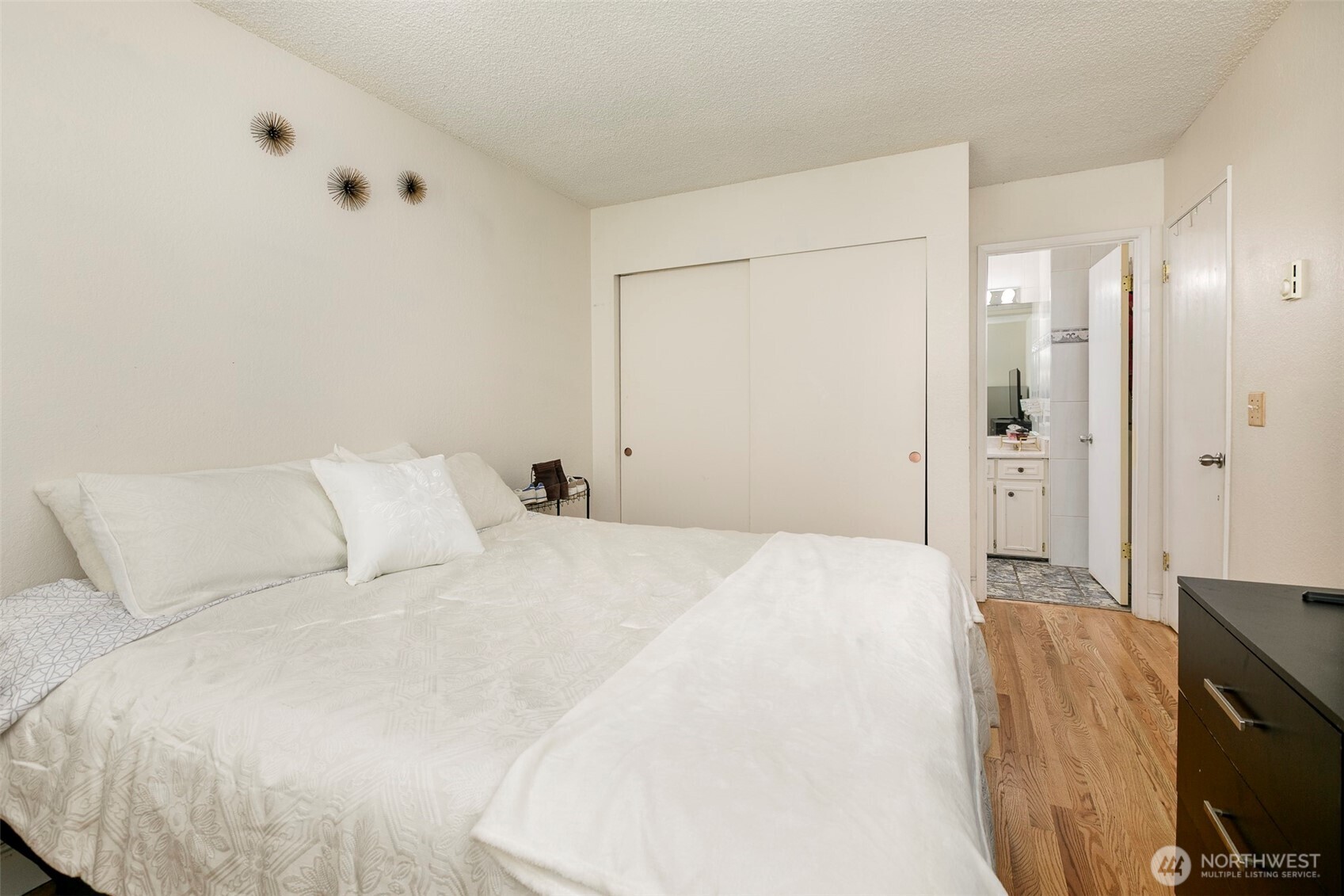 4003 Northeast 6th Court Renton, WA 98056 - Photo 11 of 20 a bedroom with a bed and a flat screen tv