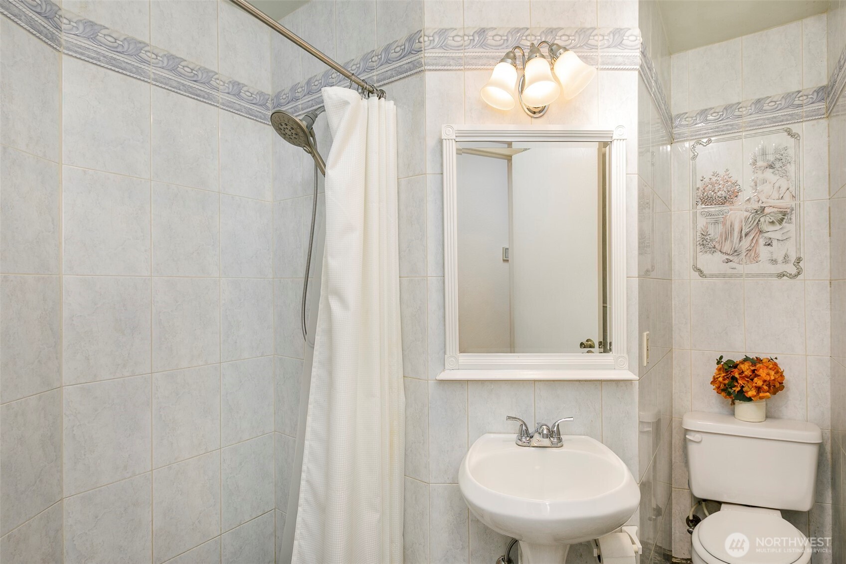 4003 Northeast 6th Court Renton, WA 98056 - Photo 14 of 20 a bathroom with a sink and a mirror