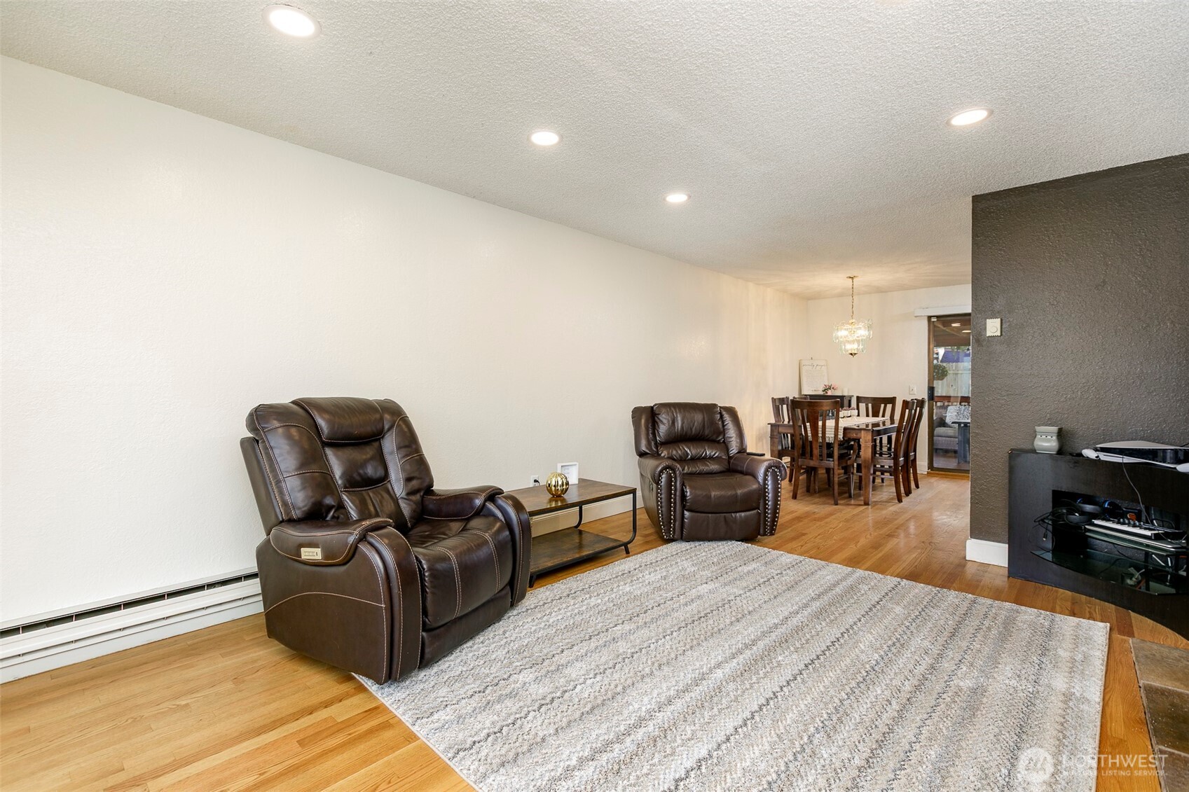 4003 Northeast 6th Court Renton, WA 98056 - Photo 19 of 20 a bed room with furniture and wooden floor