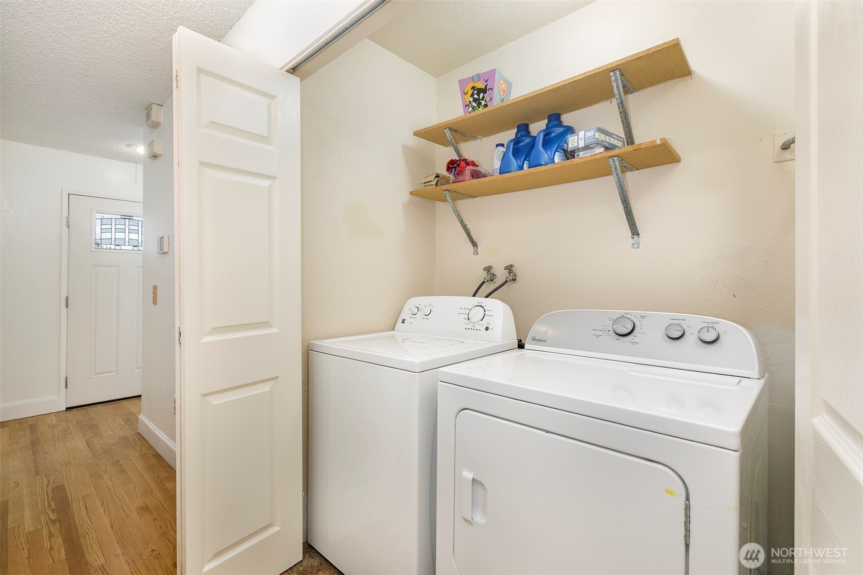4003 Northeast 6th Court Renton, WA 98056 - Photo 20 of 20 a view of storage and utility room with dryer and washer