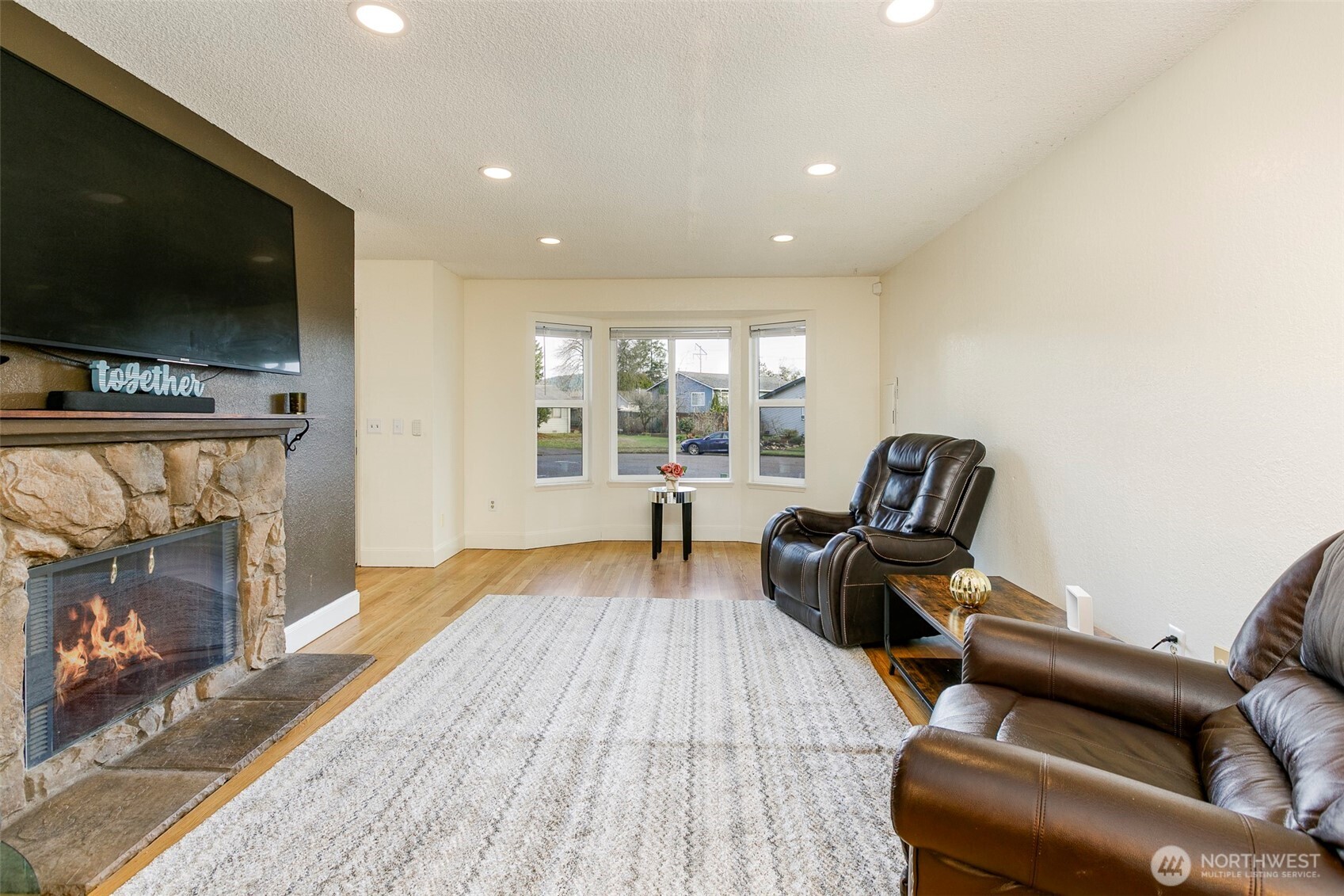 4003 Northeast 6th Court Renton, WA 98056 - Photo 3 of 20 a living room with furniture and a flat screen tv