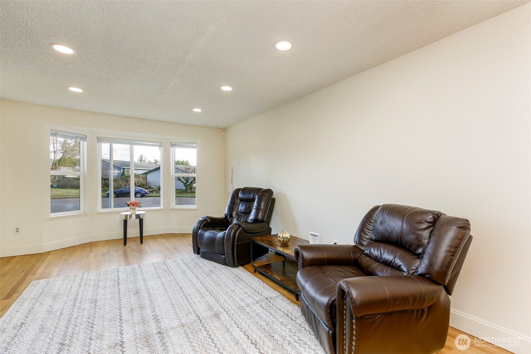 4003 Northeast 6th Court Renton, WA 98056 - Photo 4 of 20 a living room with furniture and a window