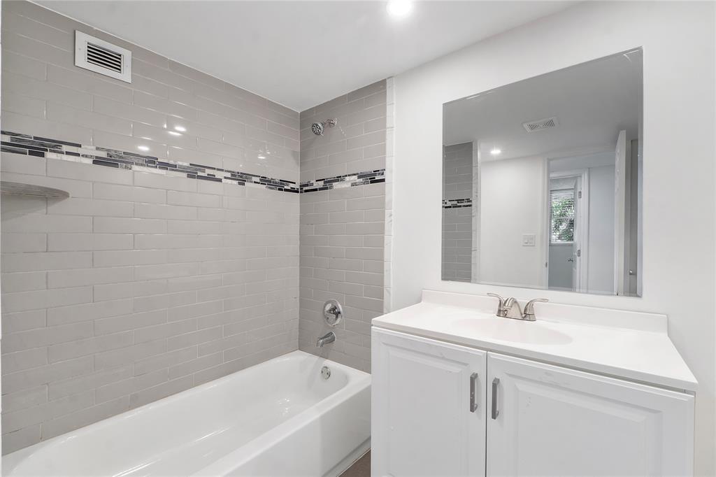 3751 Environ Boulevard, Unit 243 Lauderhill, FL 33319 - Photo 19 of 24 a bathroom with a sink a toilet and shower