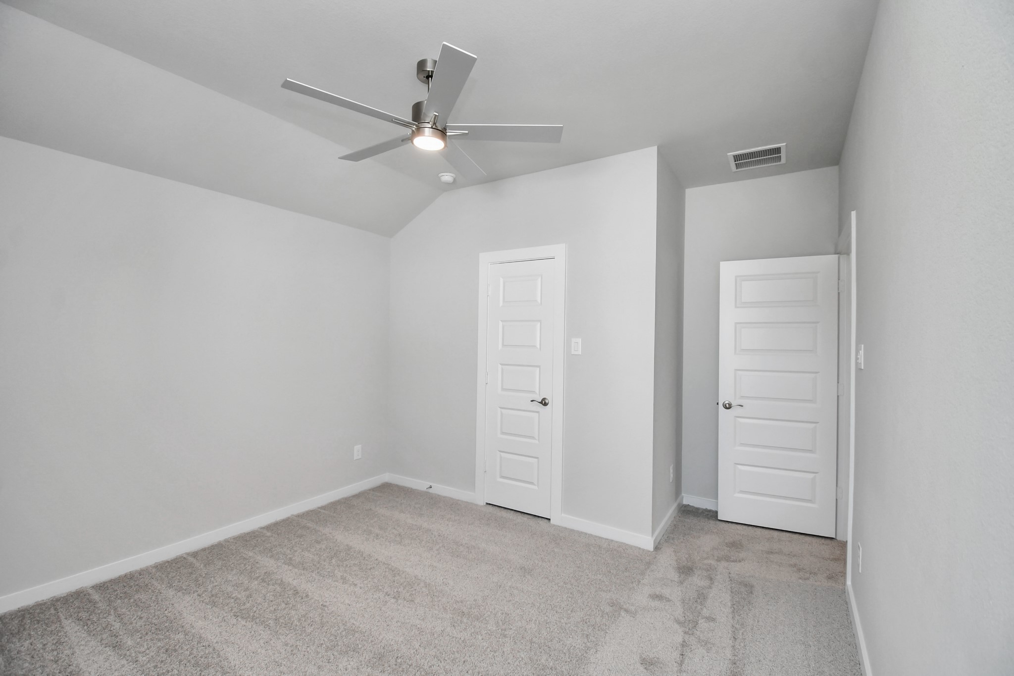 24722 Skerne Woods Drive Spring, TX 77373 - Photo 26 of 39 Generously sized secondary bedrooms featuring spacious closets, soft and inviting carpeting underfoot, large windows allowing plenty of natural light, and the added touch of privacy blinds for your personal retreat. Sample photo of completed home with similar floor plan. Actual colors and selections may vary.
