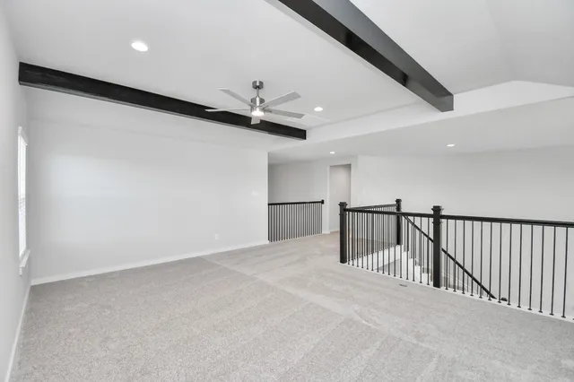 a bathroom with a granite countertop sink a toilet and shower