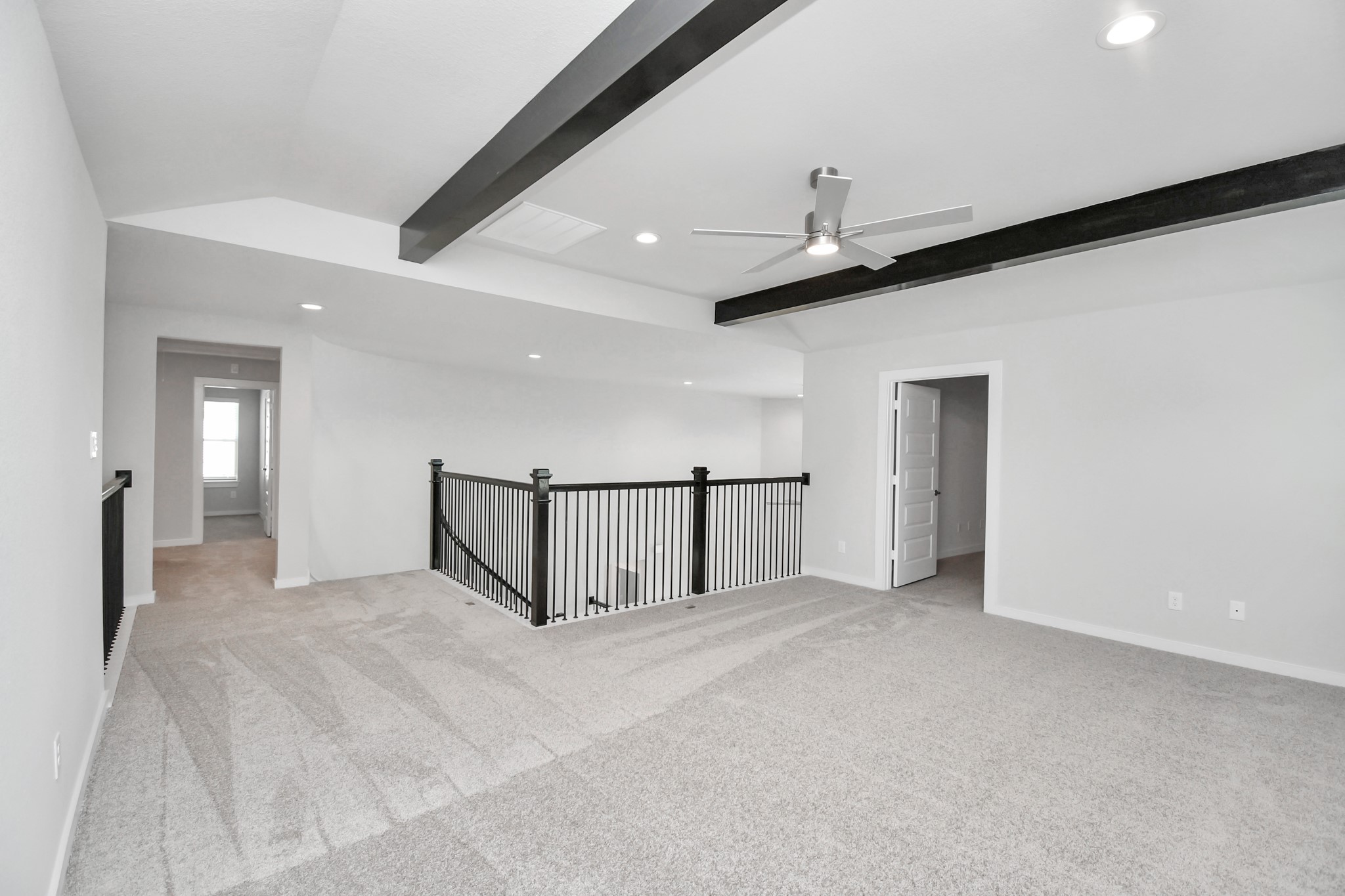 24722 Skerne Woods Drive Spring, TX 77373 - Photo 33 of 39 Discover a haven of leisure in this fantastic game room! Whether you're seeking a casual hangout or an adult gaming retreat, this space has it all. Enjoy the luxurious feel of plush carpet underfoot, the expansive ambiance of high ceilings, custom paint that adds a touch of personality, and windows that flood the room with refreshing natural light. Sample photo of completed home with similar floor plan. Actual colors and selections may vary.