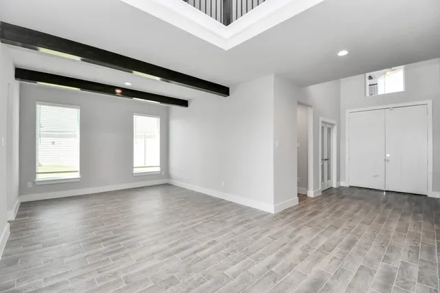 a large kitchen with kitchen island a sink stainless steel appliances and cabinets