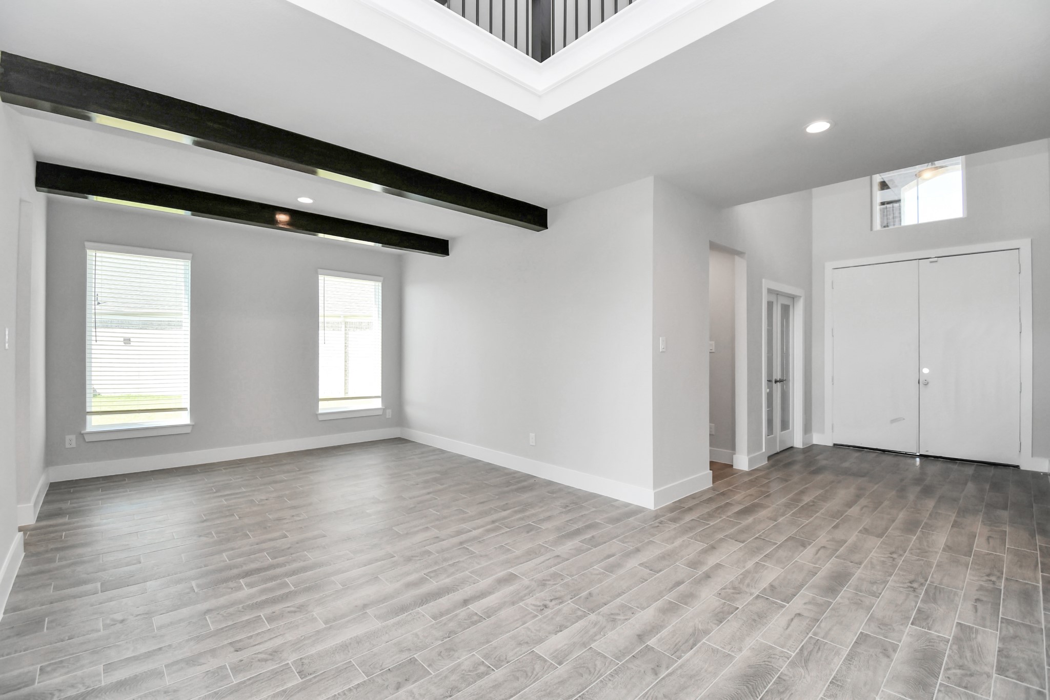 24722 Skerne Woods Drive Spring, TX 77373 - Photo 7 of 39 Craft enduring memories with loved ones around the table! This roomy dining area boasts stylish flooring, personalized paint, and is conveniently situated next to the family room and kitchen, fostering an open and inclusive ambiance. Sample photo of completed home with similar floor plan. Actual colors and selections may vary.