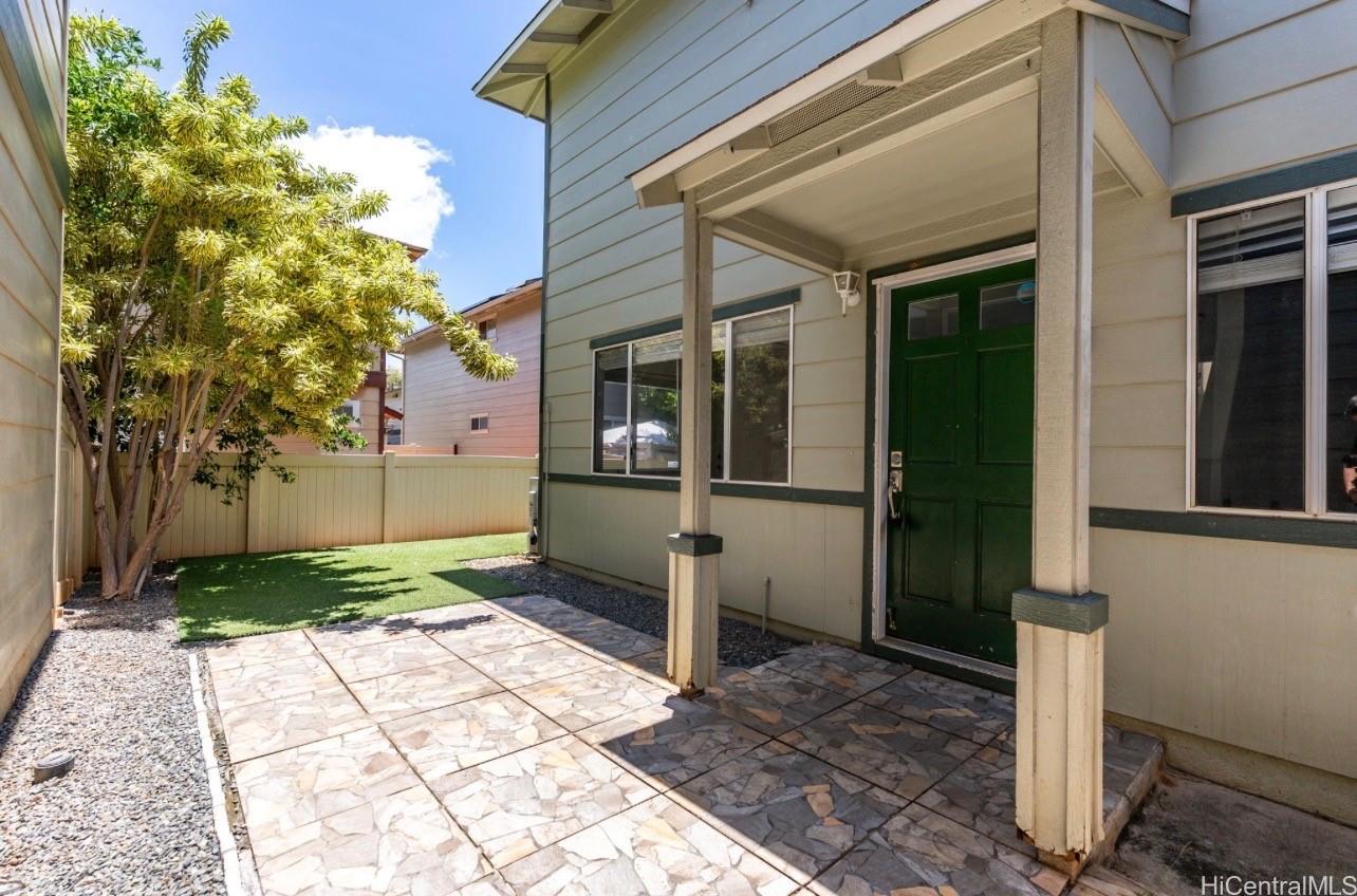 91-241 Makalauna Place, Unit 15 Ewa Beach, HI 96706 - Photo 1 of 15 a view of a pathway with a house