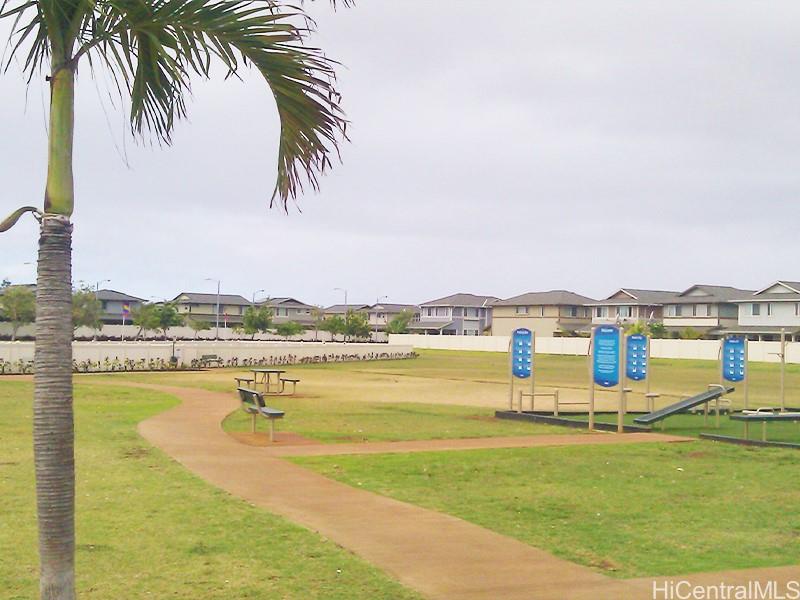 91-241 Makalauna Place, Unit 15 Ewa Beach, HI 96706 - Photo 11 of 15 a view of a lake with a mountain view
