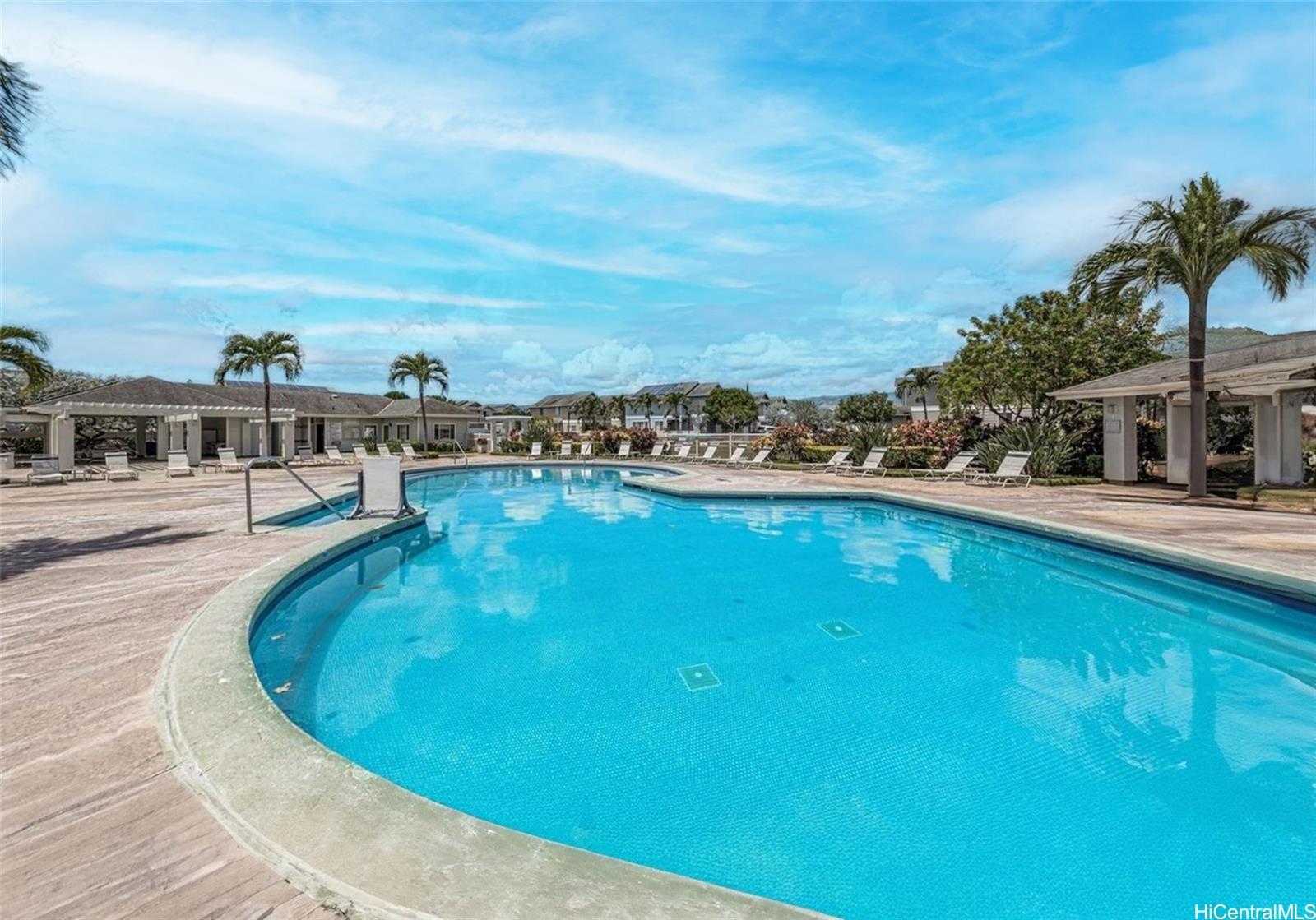 91-241 Makalauna Place, Unit 15 Ewa Beach, HI 96706 - Photo 14 of 15 a view of a swimming pool with an outdoor seating