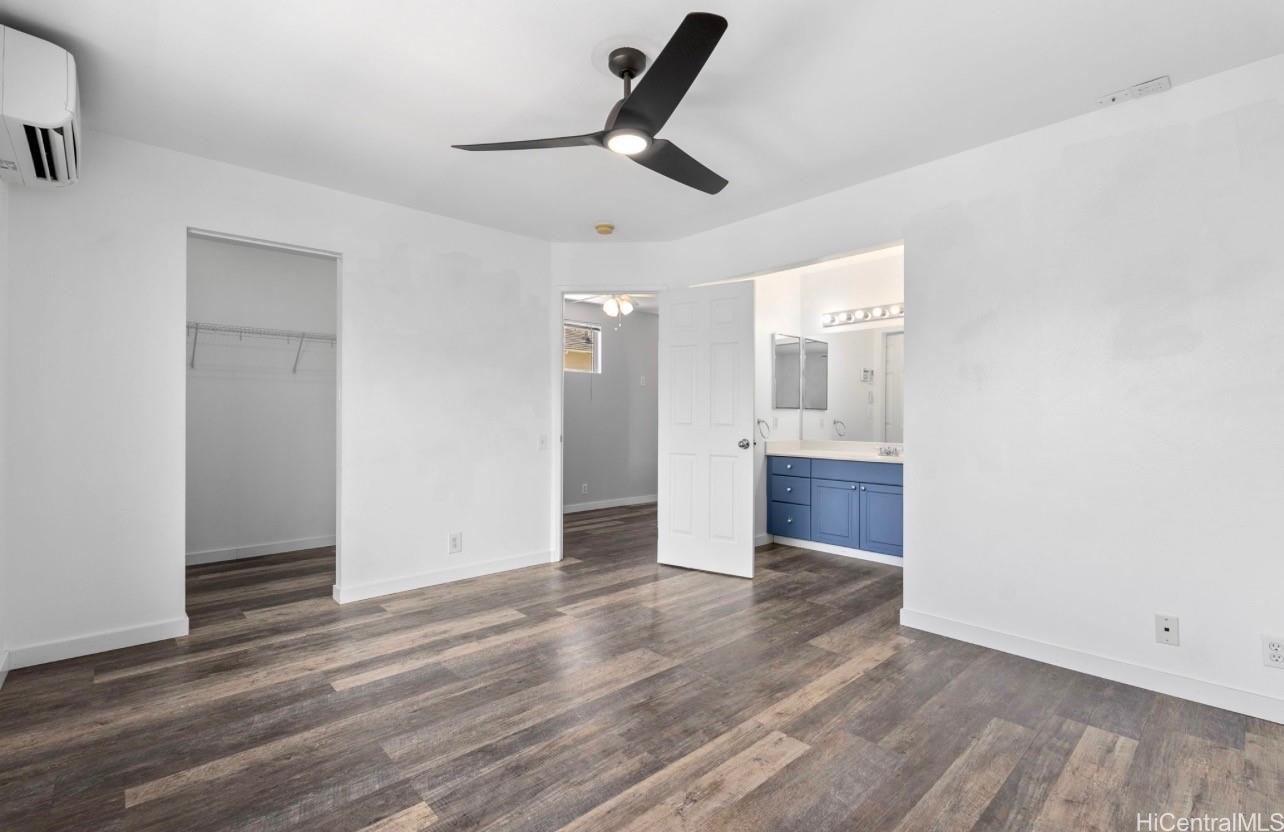 91-241 Makalauna Place, Unit 15 Ewa Beach, HI 96706 - Photo 6 of 15 an empty room with wooden floor and windows