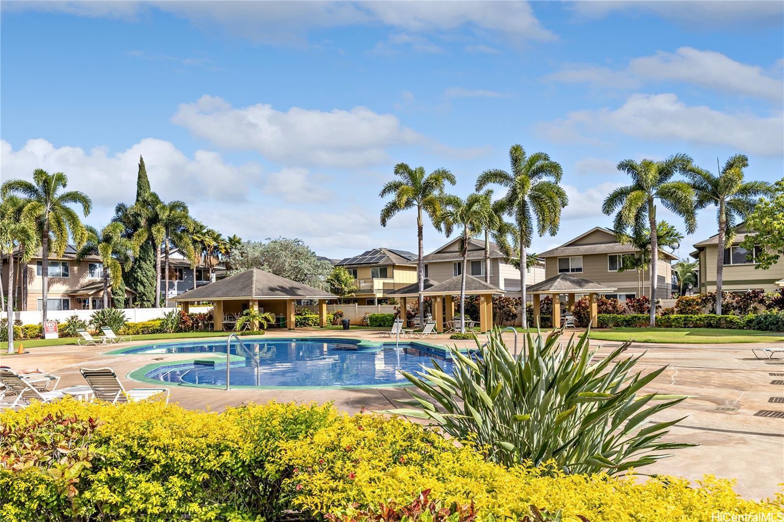 91-241 Makalauna Place, Unit 15 Ewa Beach, HI 96706 - Photo 8 of 15 a view of an swimming pool with an outdoor seating
