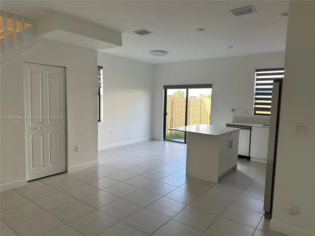 a view of kitchen with windows