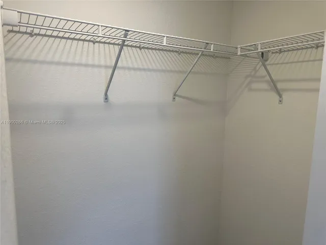 a white toilet sitting next to a bath tub