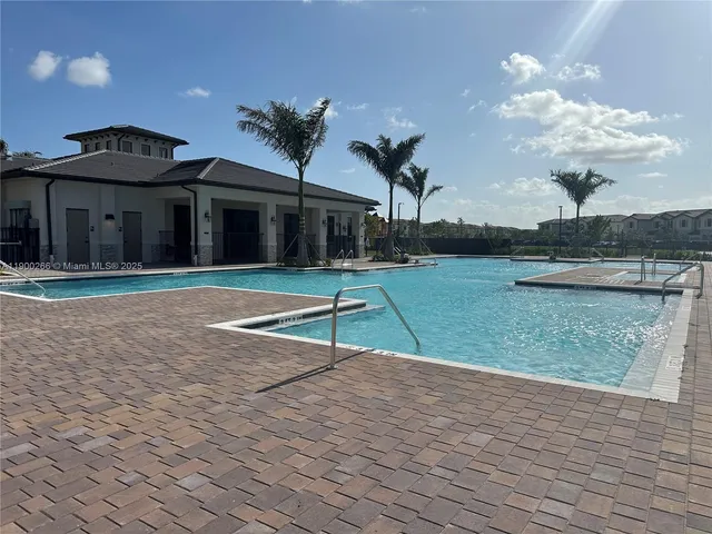 a view of a park with swings and slides