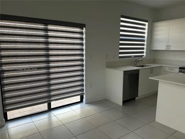 a view of kitchen and utility room