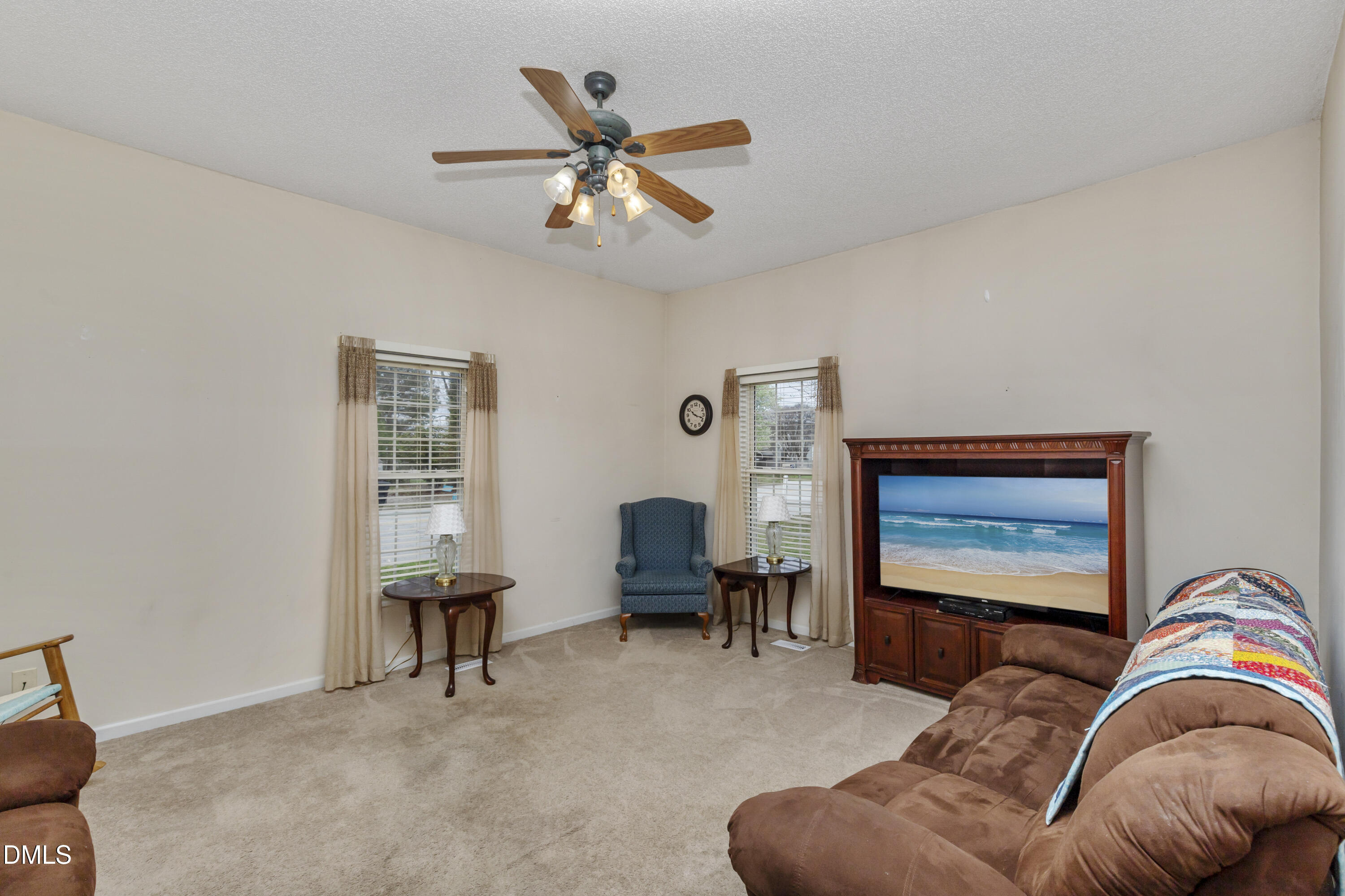 100 East E Street Erwin, NC 28339 - Photo 14 of 27 a living room with furniture ceiling fan and a window