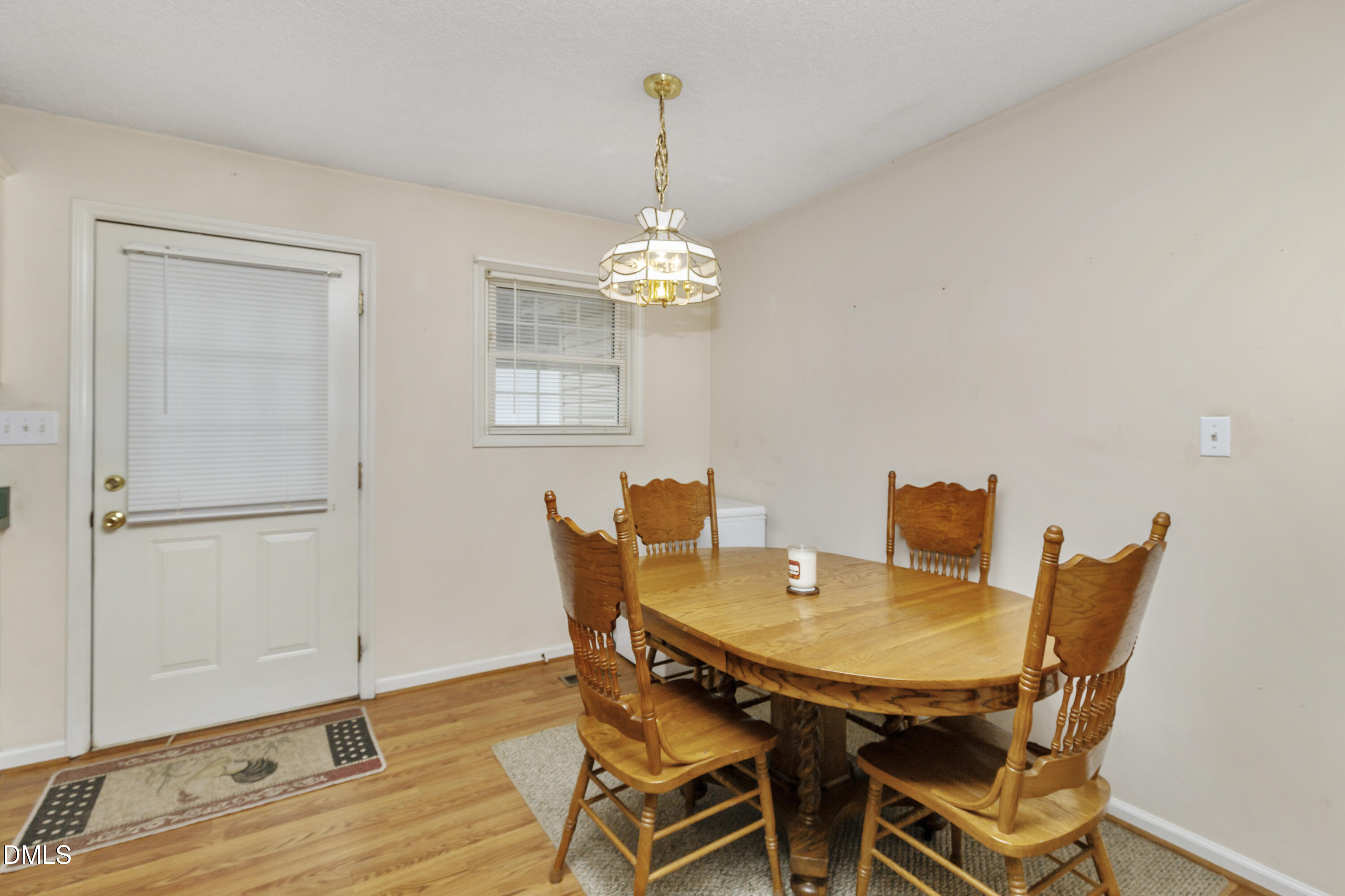 100 East E Street Erwin, NC 28339 - Photo 20 of 27 a view of a dining room with furniture and wooden floor