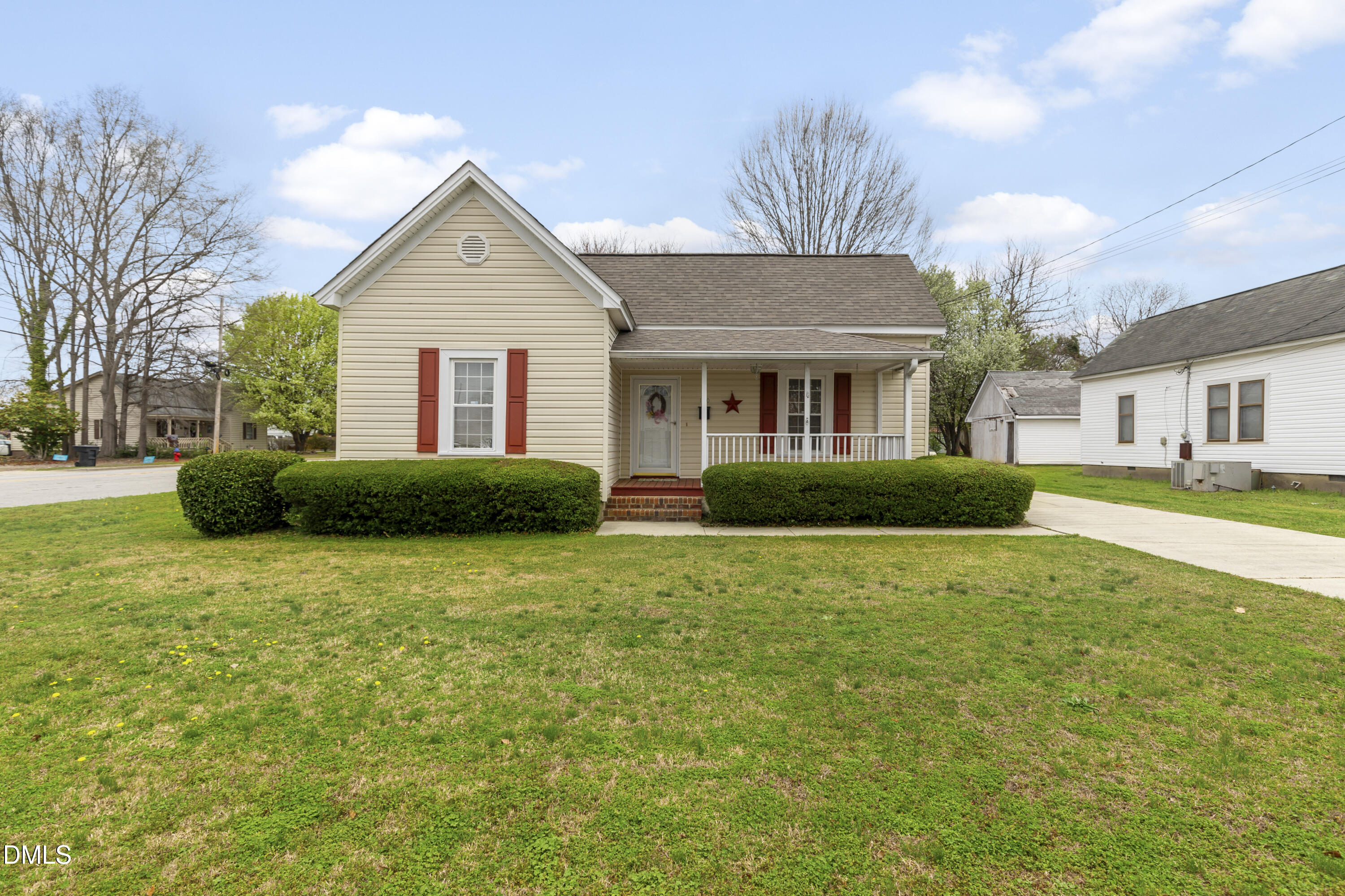 100 East E Street Erwin, NC 28339 - Photo 2 of 27 a front view of house with yard and trees around