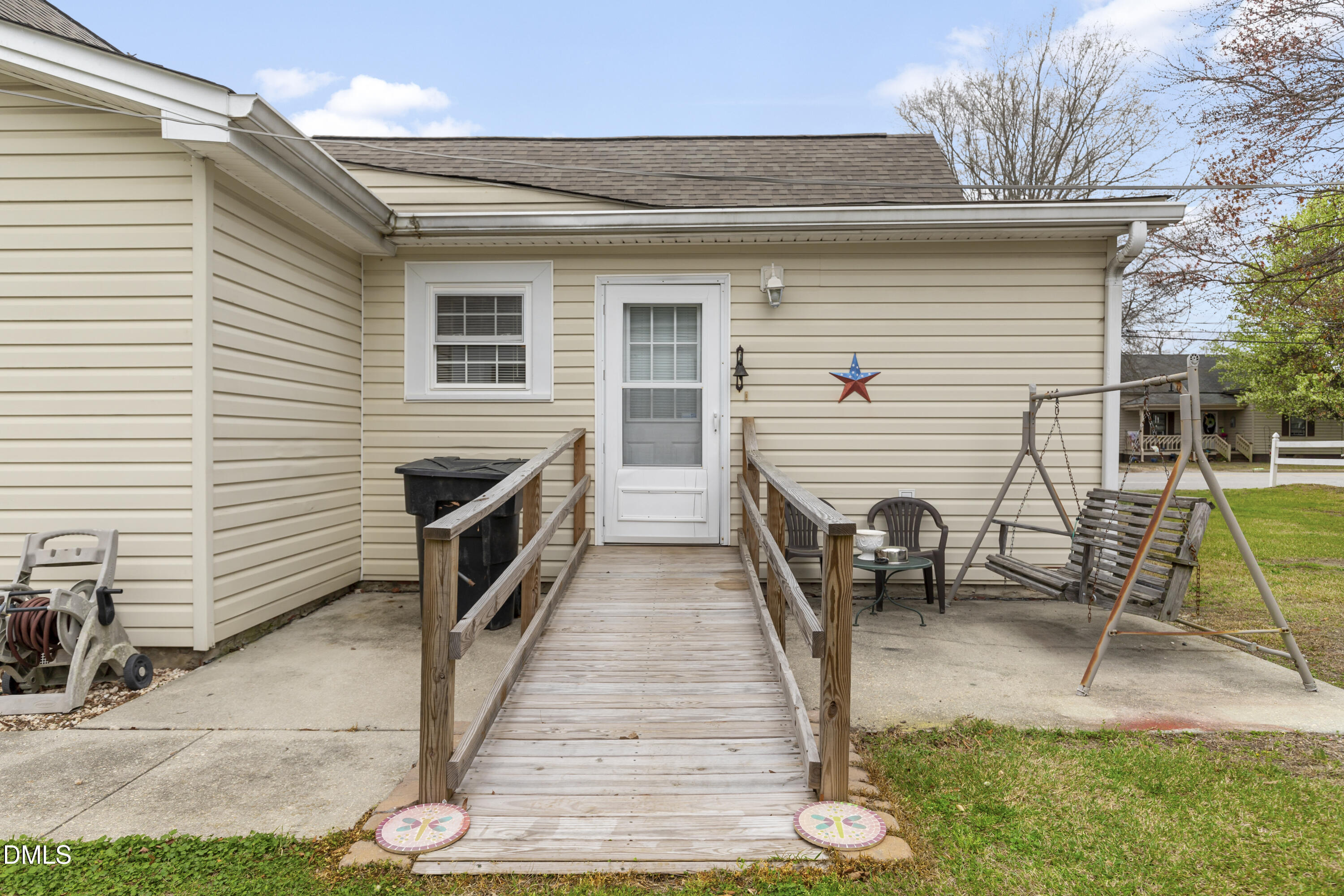 100 East E Street Erwin, NC 28339 - Photo 24 of 27 a view of a chairs and a tables in the patio