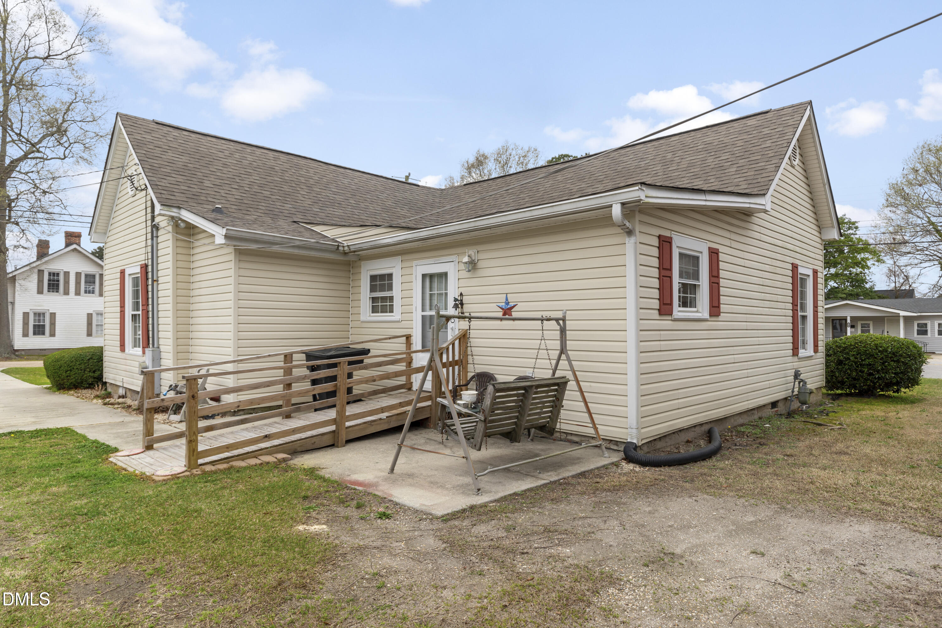 100 East E Street Erwin, NC 28339 - Photo 26 of 27 a view of a house with a back yard