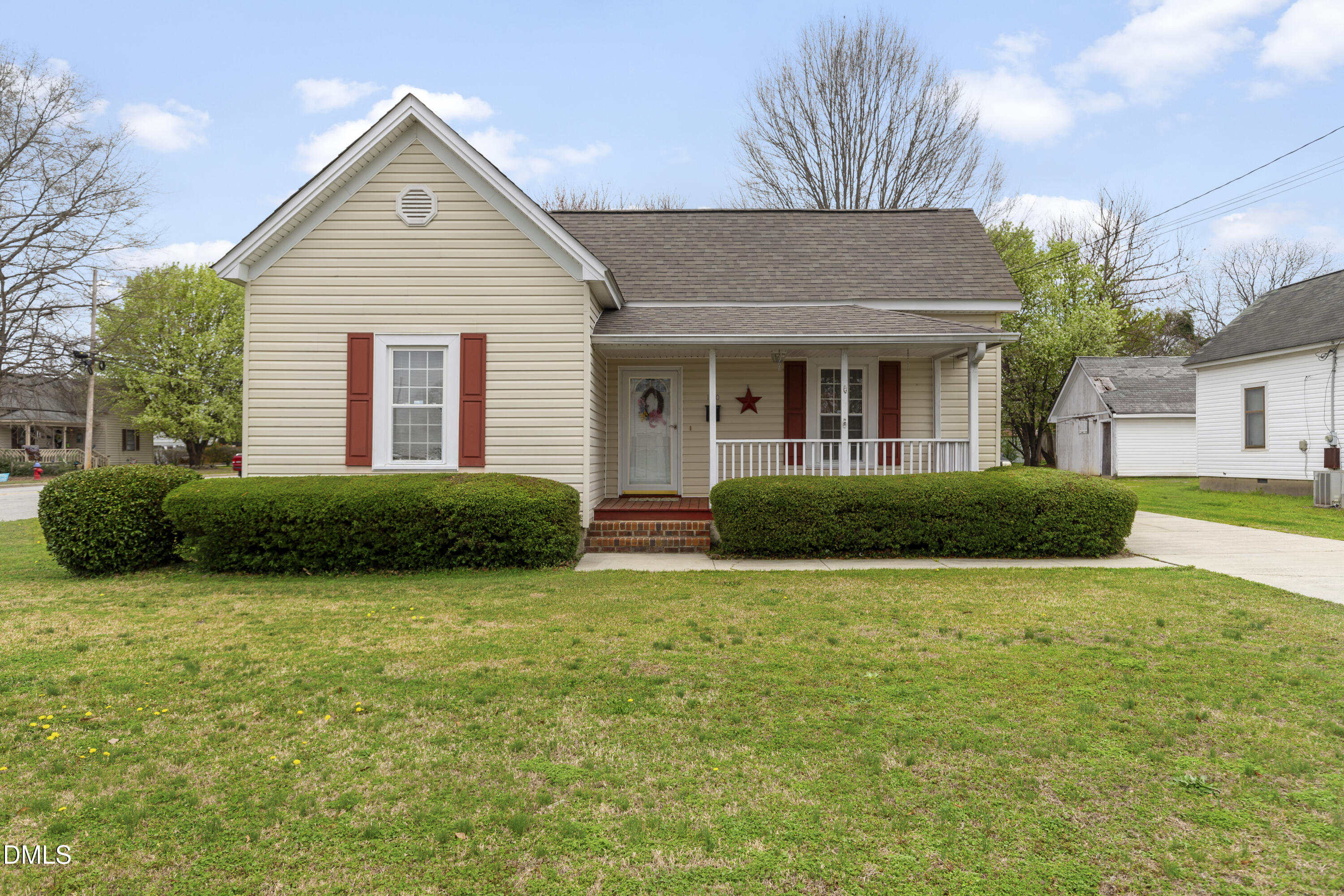 100 East E Street Erwin, NC 28339 - Photo 3 of 27 a view of a house with backyard and garden