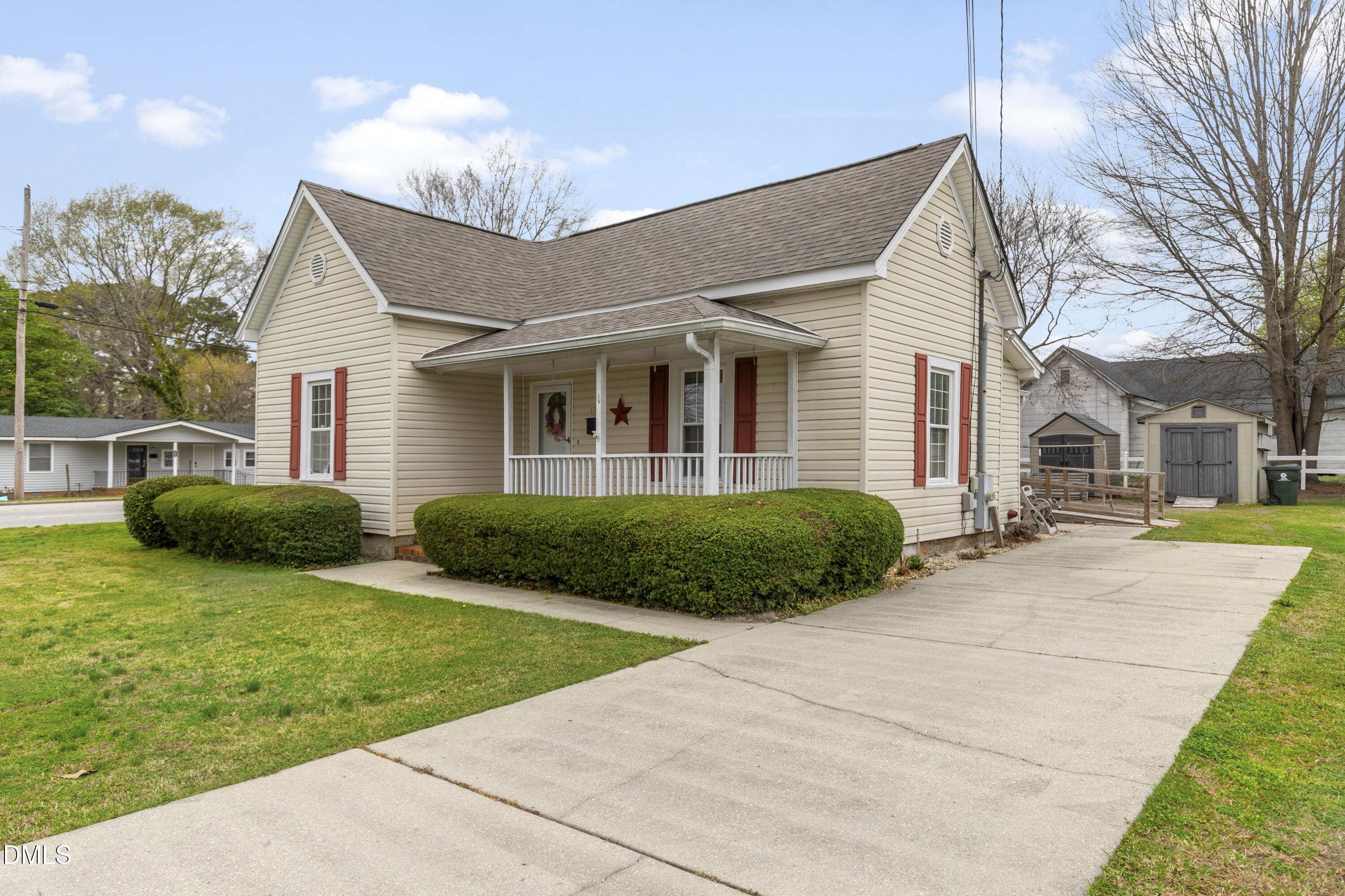 100 East E Street Erwin, NC 28339 - Photo 4 of 27 a view of a house with a yard and plants