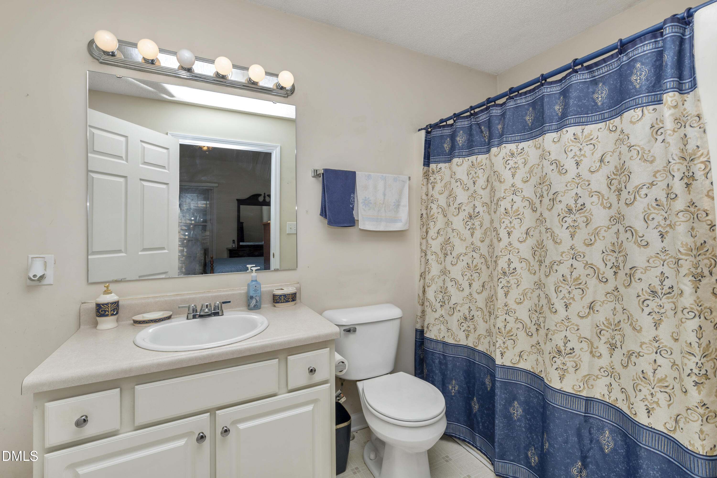 100 East E Street Erwin, NC 28339 - Photo 8 of 27 a bathroom with a sink toilet and shower