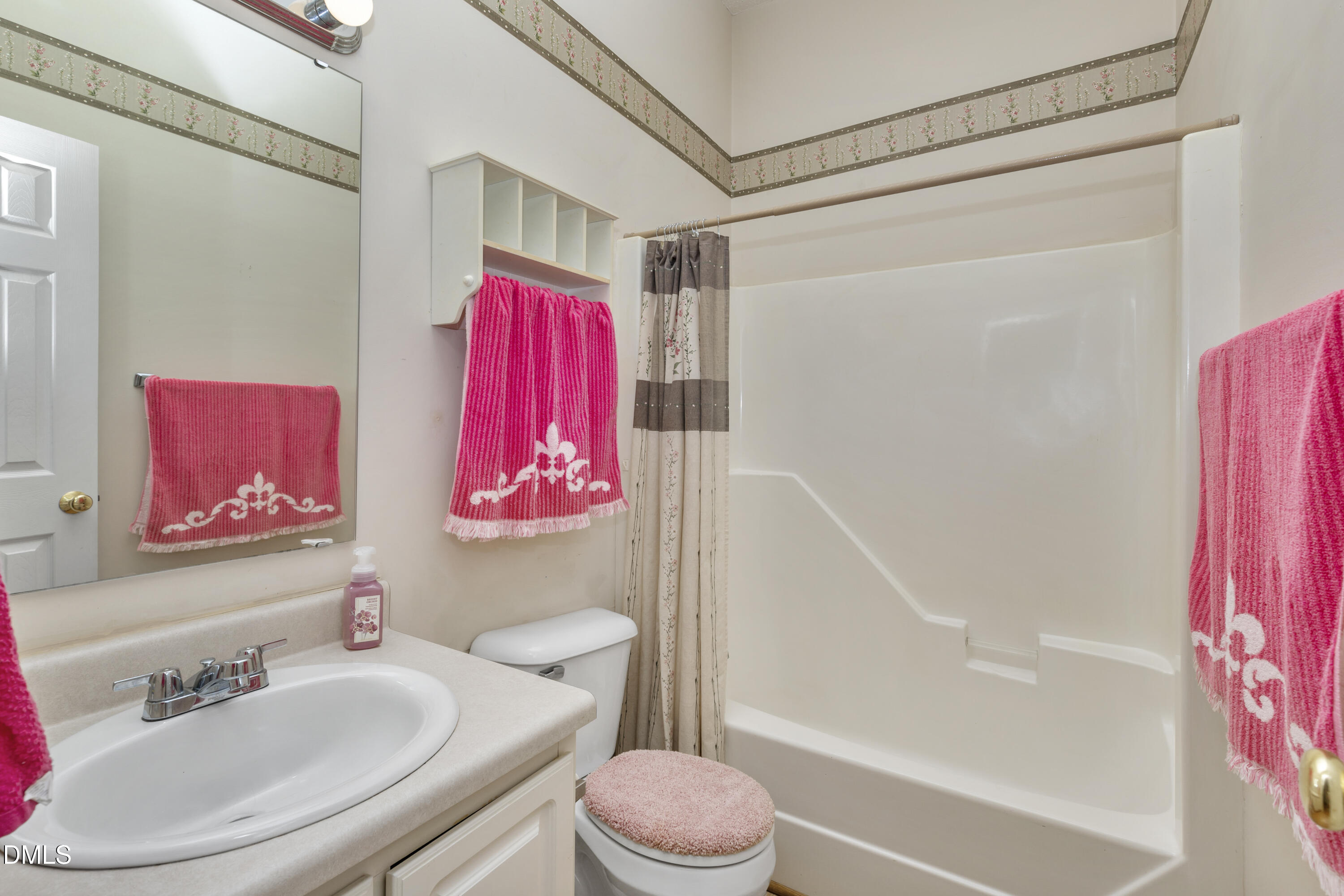 100 East E Street Erwin, NC 28339 - Photo 9 of 27 a bathroom with a sink toilet and shower
